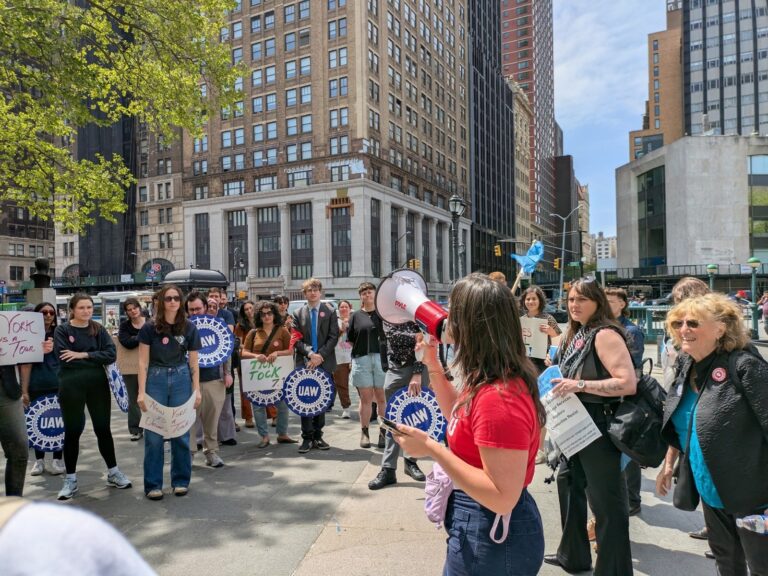 Legal services workers rally after picketing Brooklyn courthouse, May 1, 2025.