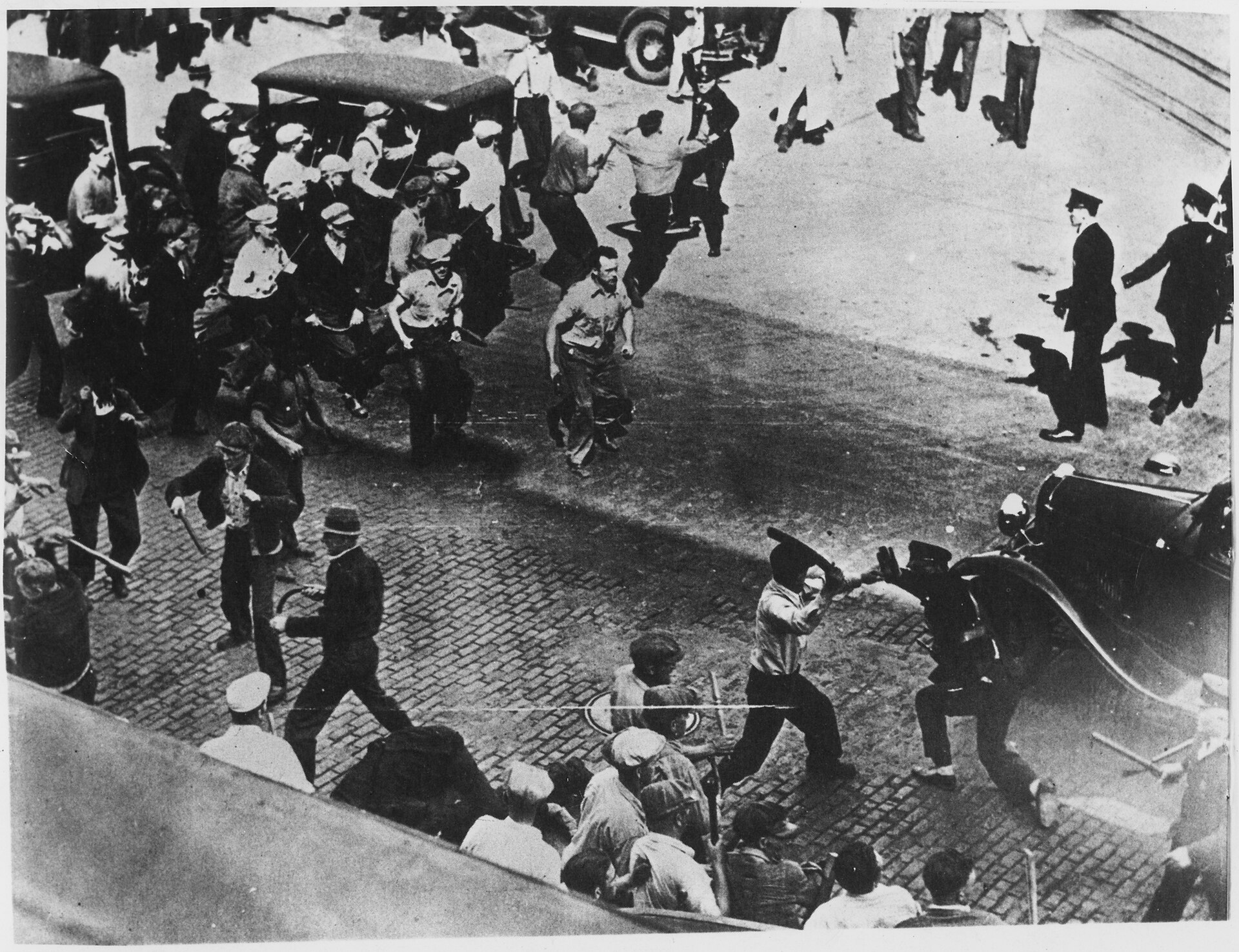 Truck drivers on strike in 1934 in Minneapolis are attacked by police